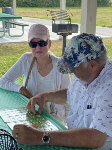 Laura and Rick play Bingo at the summer picnic