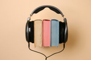 Headphones clamped around books