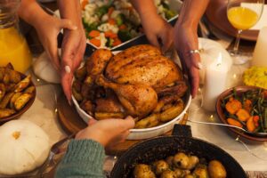 hands holding turkey platter