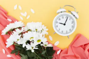 top-view-arrangement-with-bouquet-clock